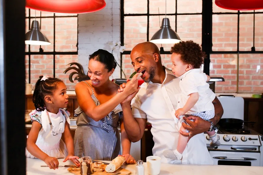 Family together in their kitchen